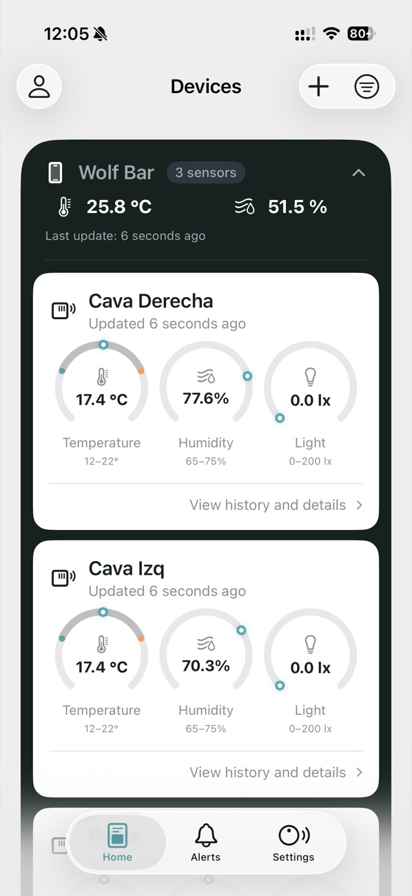 The Tali app home screen showing live temperature, humidity and light gauges for two cellar sensors